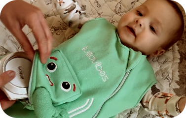Illustration of Woojer being inserted into a swaddle